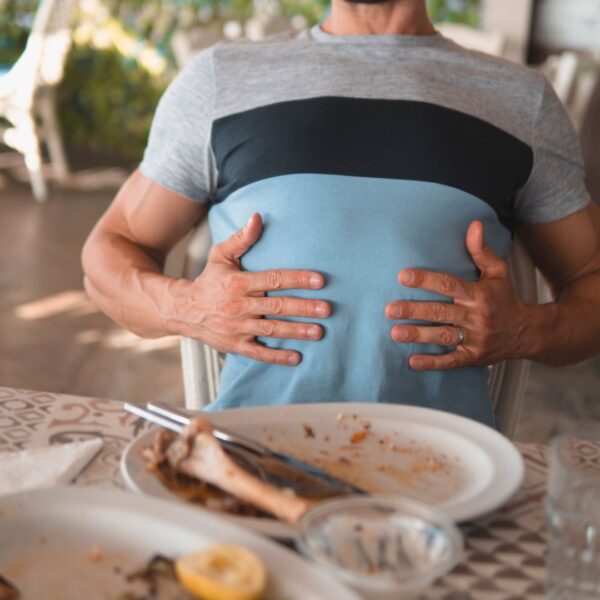 Man feeling full after a meal