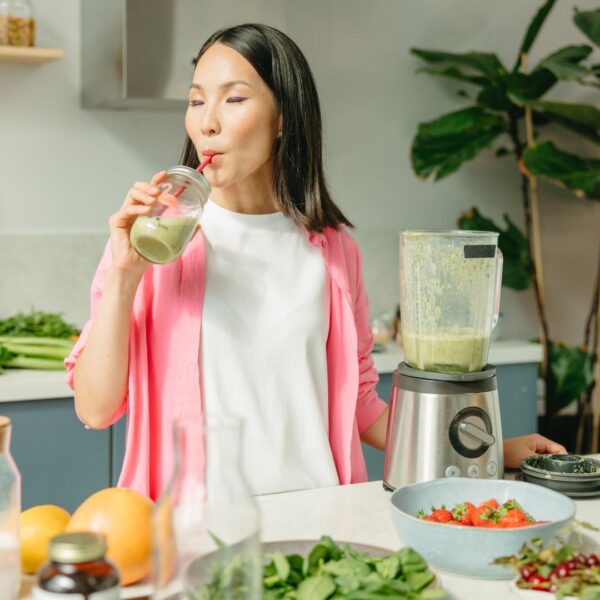 img og a woman drinking a smoothie